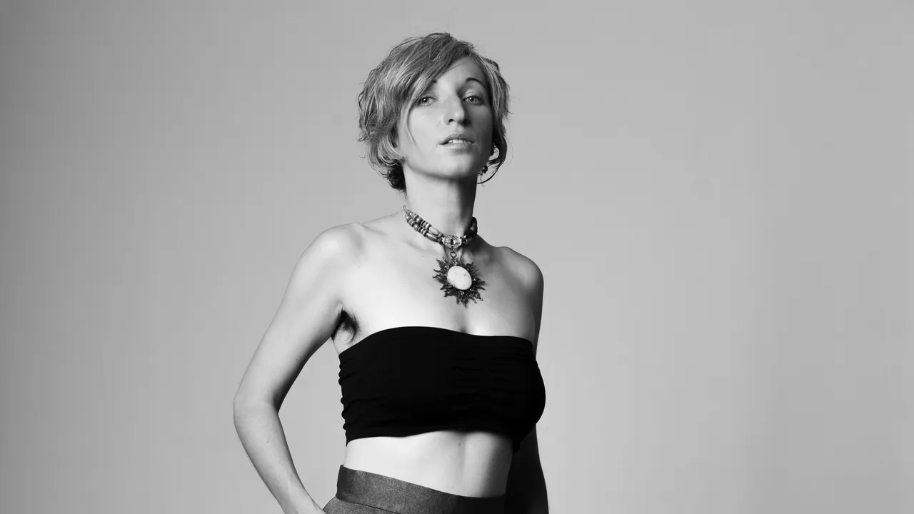ZOE from Earth, black and white, hands on hips